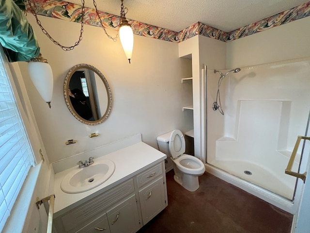 bathroom featuring a shower, toilet, vanity, and a textured ceiling