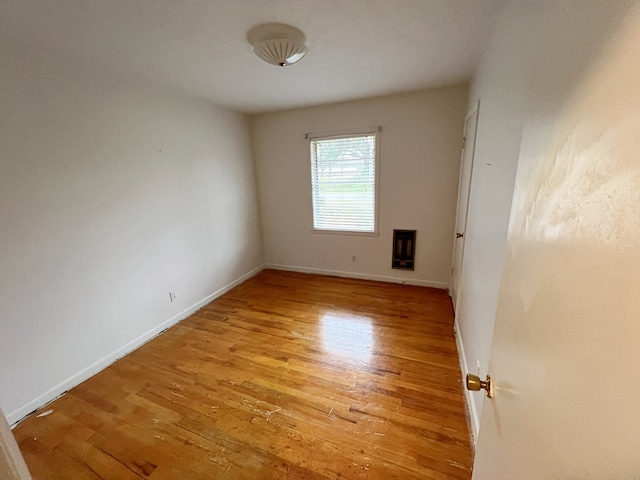 spare room with light hardwood / wood-style floors