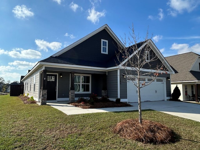 craftsman house featuring a porch, a garage, and a front lawn