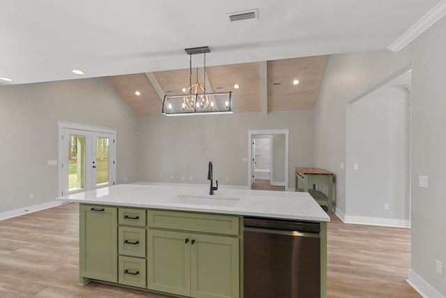 kitchen with vaulted ceiling with beams, stainless steel dishwasher, a sink, green cabinetry, and baseboards