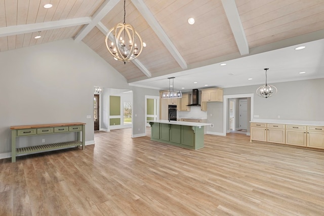 kitchen with light wood-style flooring, wall chimney range hood, decorative backsplash, beamed ceiling, and an inviting chandelier