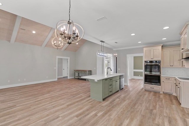 kitchen with visible vents, a sink, black electric stovetop, double oven, and backsplash