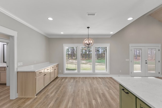 kitchen with crown molding, light wood finished floors, recessed lighting, and a notable chandelier