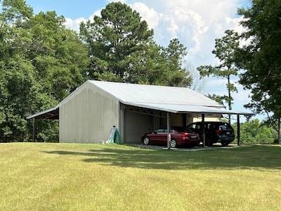 view of parking / parking lot with a lawn