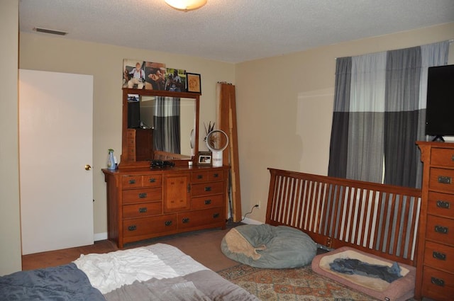 bedroom featuring a textured ceiling