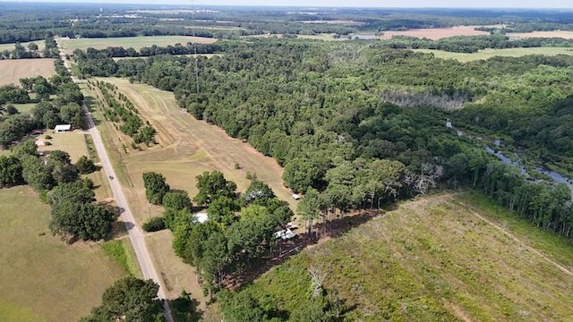 birds eye view of property with a rural view