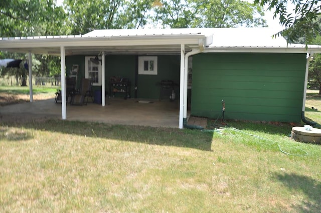 rear view of property with a lawn