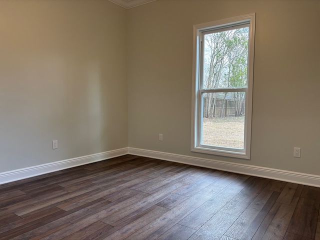 unfurnished room featuring dark hardwood / wood-style flooring