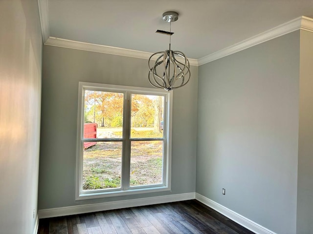 unfurnished dining area with crown molding, dark hardwood / wood-style floors, and a chandelier