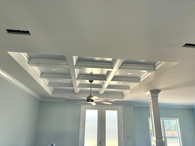 room details with decorative columns, beamed ceiling, coffered ceiling, ceiling fan, and crown molding