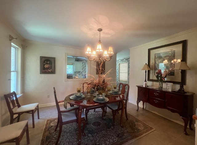 dining area featuring a chandelier, ornamental molding, and a healthy amount of sunlight