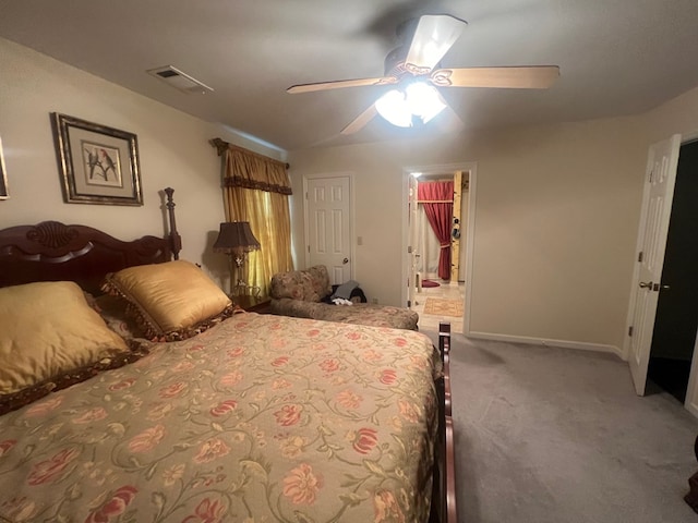 bedroom with a spacious closet, ceiling fan, carpet floors, and a closet