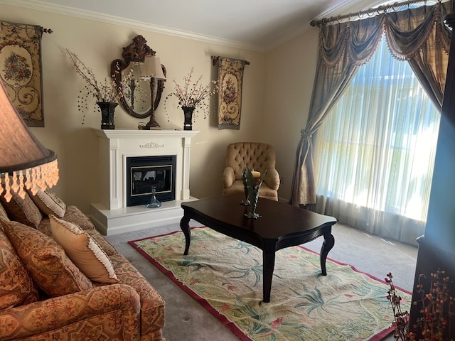 sitting room featuring carpet flooring, plenty of natural light, and ornamental molding