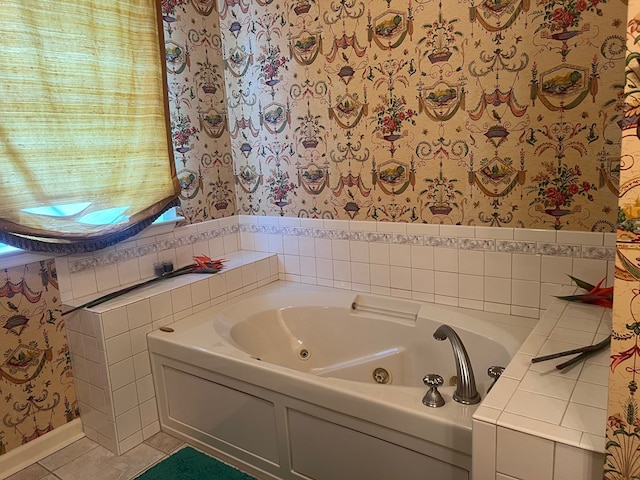 bathroom featuring a washtub and tile patterned flooring