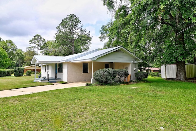 382 Timbers Dr, Dothan, AL 36301 - view of front facade with driveway, a front lawn, a carport, covered porch, and stucco siding
