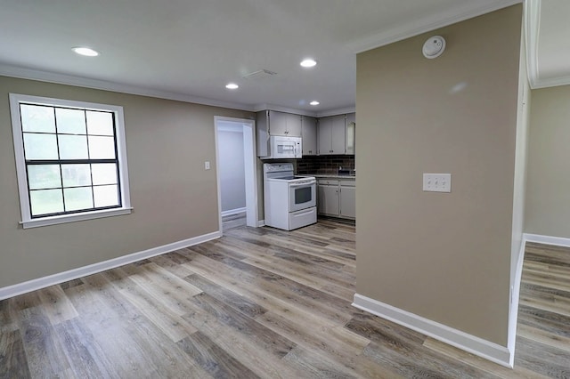 382 Timbers Dr, Dothan, AL 36301 - kitchen featuring white appliances, ornamental molding, decorative backsplash, baseboards, and light wood-style floors