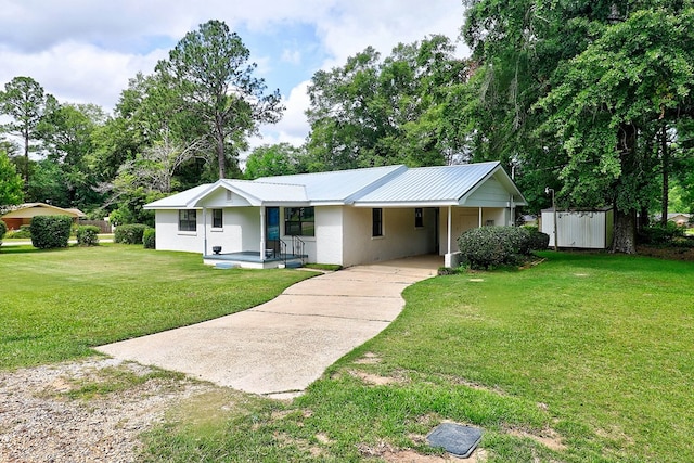 382 Timbers Dr, Dothan, AL 36301 - ranch-style house featuring driveway, a front lawn, a carport, metal roof, and stucco siding