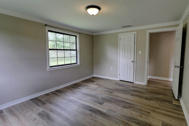 382 Timbers Dr, Dothan, AL 36301 - unfurnished bedroom featuring wood finished floors, baseboards, and crown molding