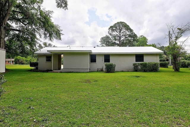 382 Timbers Dr, Dothan, AL 36301 - rear view of house with a lawn and metal roof