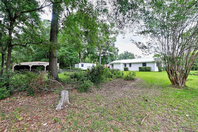 382 Timbers Dr, Dothan, AL 36301 - view of green lawn with an outdoor structure