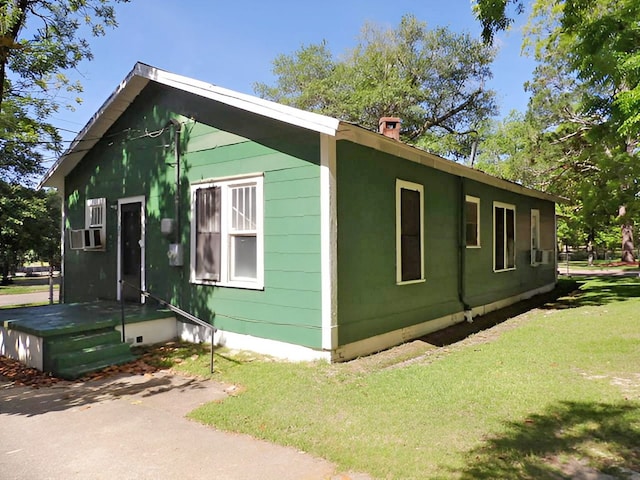 201 Ruth St, Dothan, AL 36303 - view of property exterior featuring a yard and a chimney