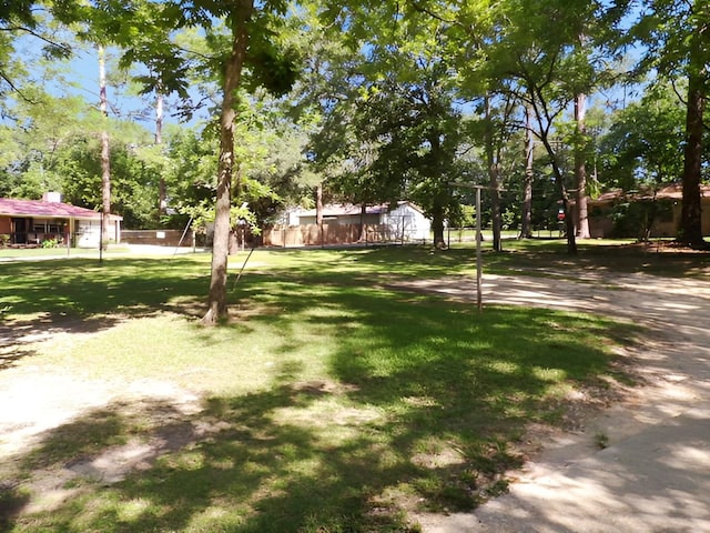 201 Ruth St, Dothan, AL 36303 - view of grassy yard featuring view of wooded area