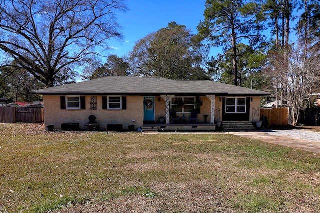 single story home featuring a front yard and covered porch