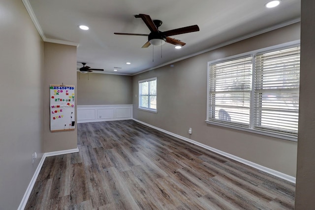 spare room with ceiling fan, ornamental molding, and wood-type flooring