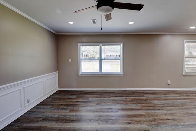 spare room with dark hardwood / wood-style flooring, ornamental molding, and ceiling fan