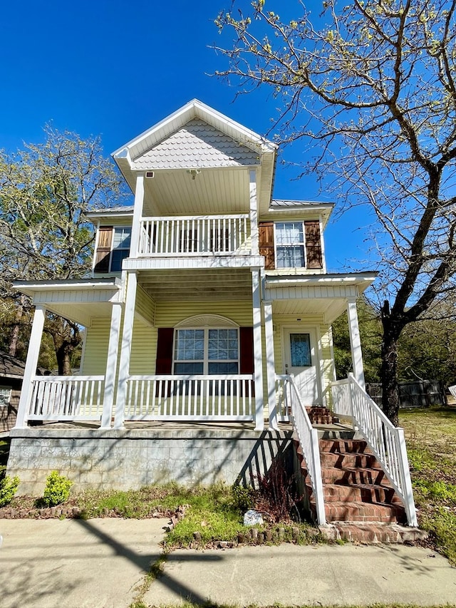 view of front of home with a balcony and a porch