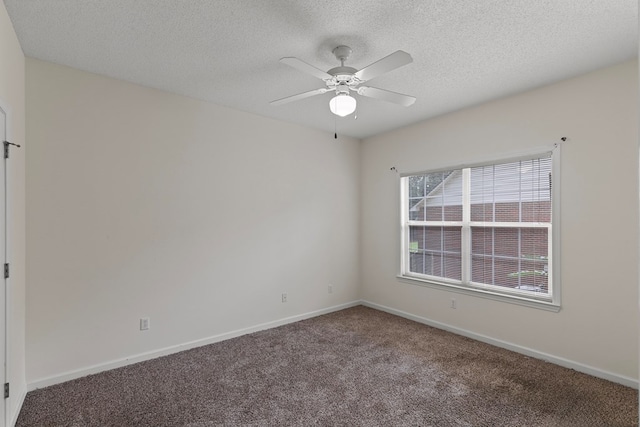 carpeted empty room featuring a textured ceiling and ceiling fan