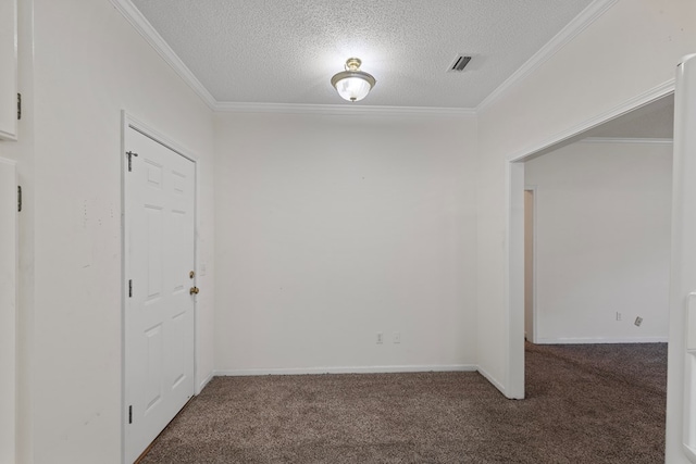 unfurnished room featuring dark carpet, a textured ceiling, and ornamental molding