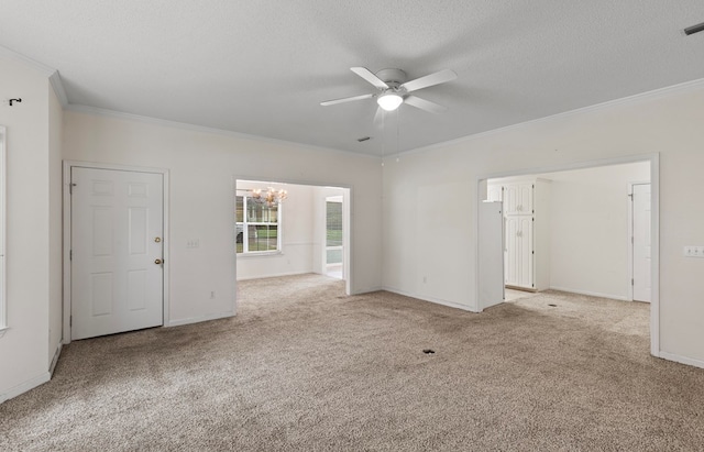 unfurnished room with ceiling fan with notable chandelier, light colored carpet, ornamental molding, and a textured ceiling