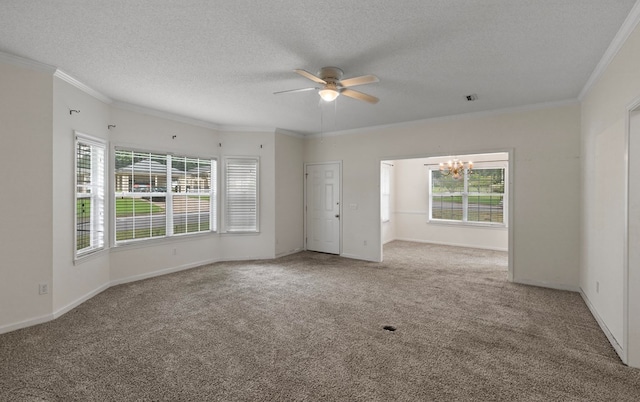 unfurnished room with carpet flooring, ornamental molding, and a textured ceiling