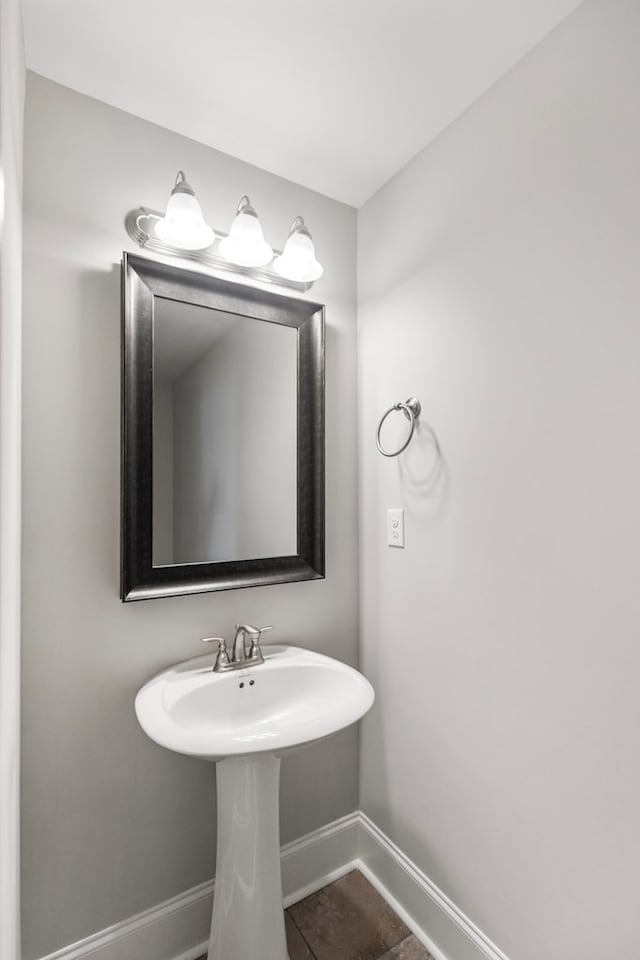 bathroom with tile patterned floors and sink