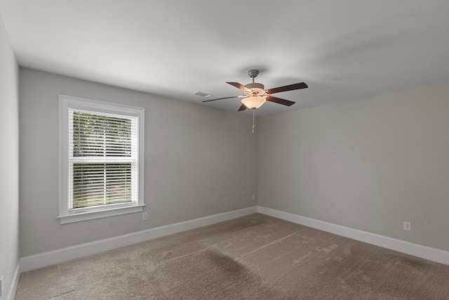 carpeted empty room with ceiling fan