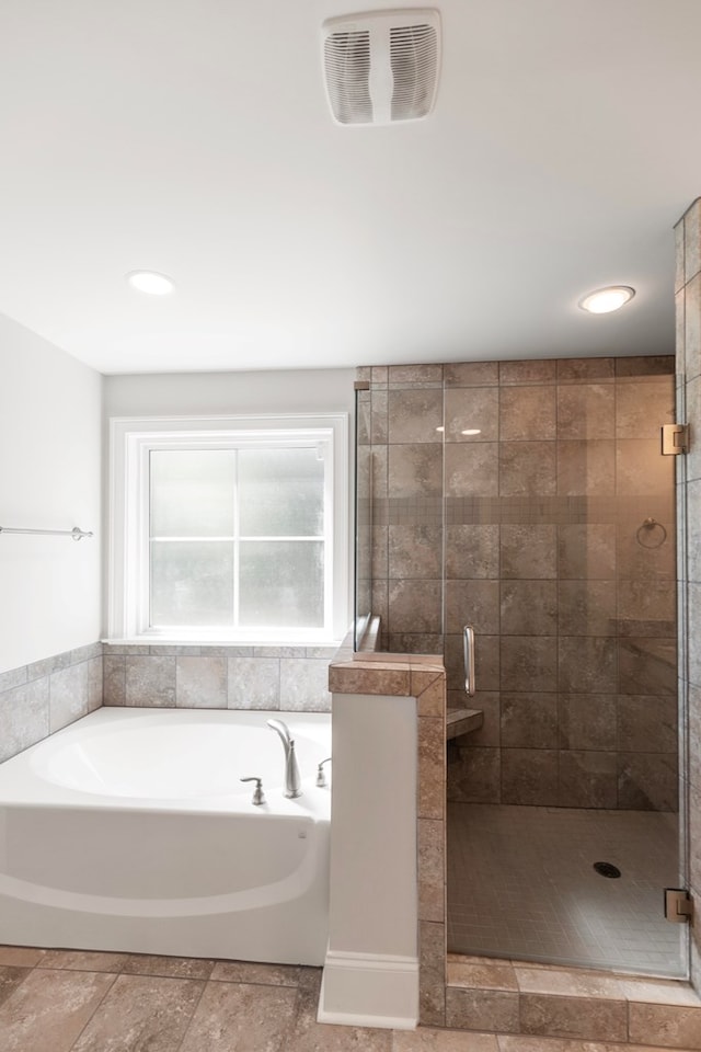 bathroom featuring plus walk in shower