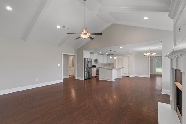 unfurnished living room with dark hardwood / wood-style flooring, ceiling fan with notable chandelier, sink, beam ceiling, and high vaulted ceiling