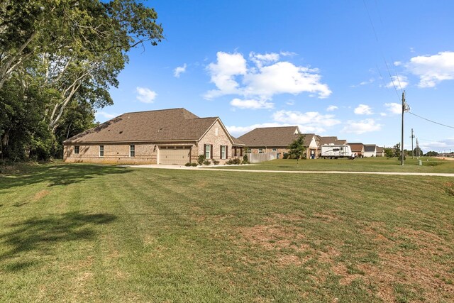 view of yard featuring a garage