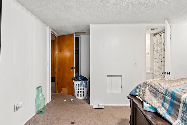 carpeted bedroom with a textured ceiling