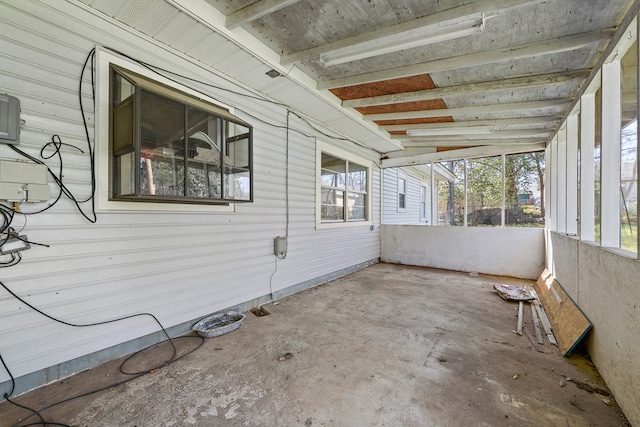 view of property exterior with a patio area