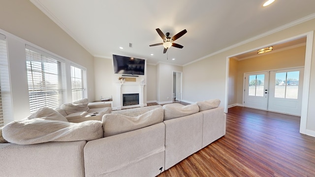 living room with dark wood-type flooring, ceiling fan, crown molding, and french doors