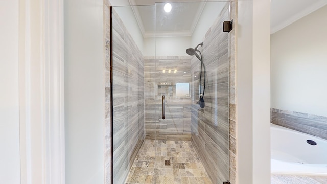 bathroom with crown molding and separate shower and tub