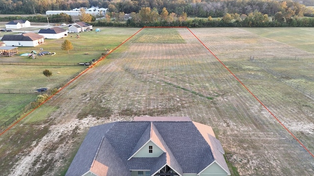 birds eye view of property featuring a rural view