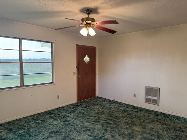 530 Pleasant Grove Rd, Ashford, AL 36312 - carpeted empty room featuring ceiling fan, heating unit, crown molding, and a textured ceiling