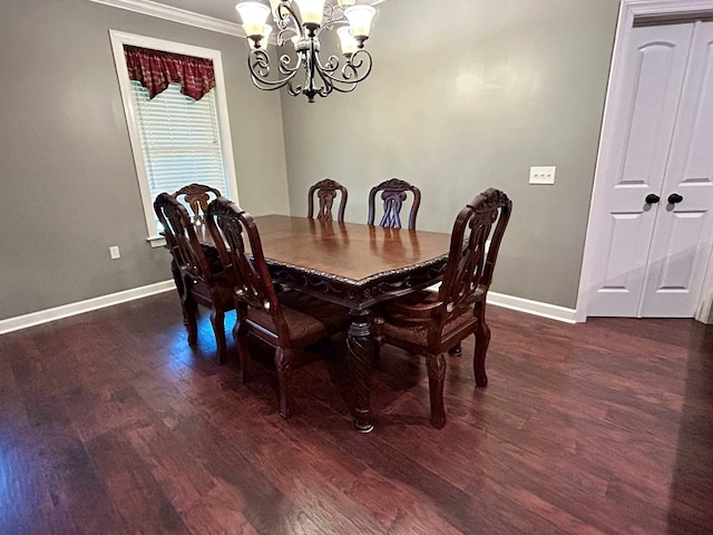 dining space featuring dark wood-type flooring, a notable chandelier, and ornamental molding