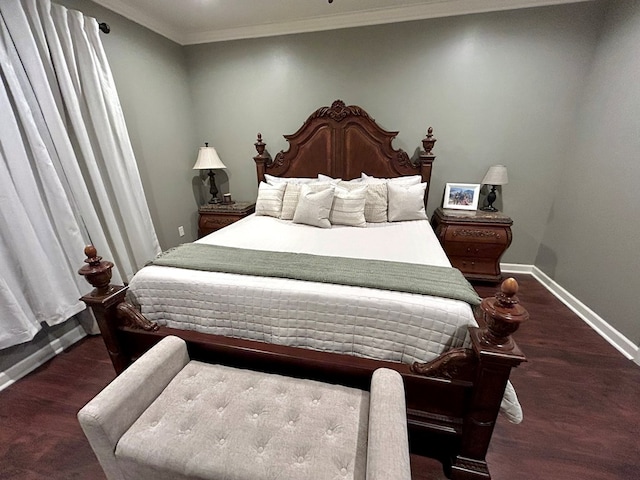 bedroom with dark hardwood / wood-style flooring and ornamental molding