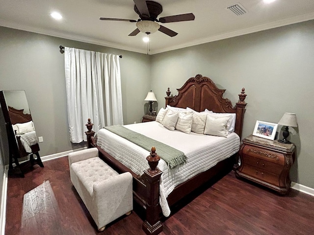 bedroom featuring dark hardwood / wood-style flooring, ceiling fan, and crown molding