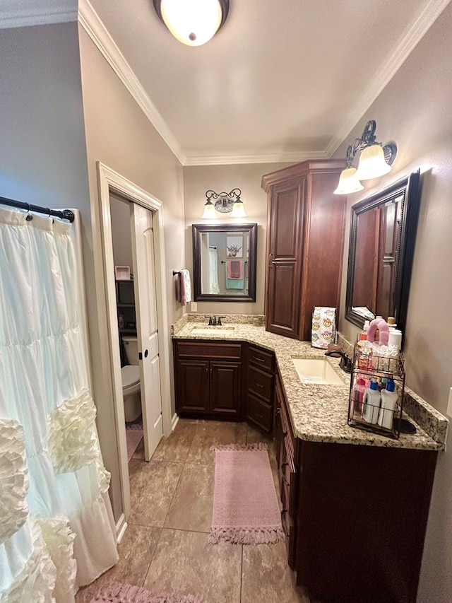 bathroom with a shower with shower curtain, vanity, crown molding, tile patterned flooring, and toilet