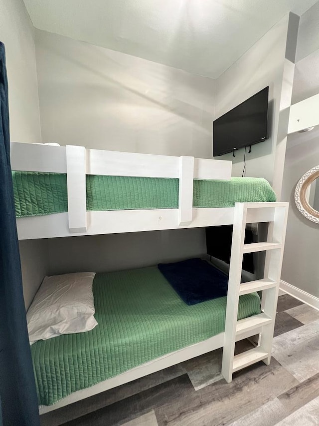 bedroom with wood finished floors